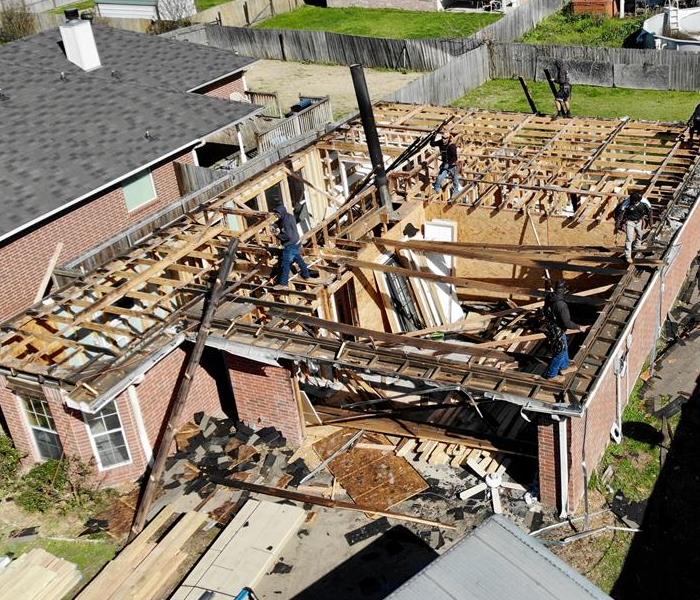 Aerial view of home after roof was removed.