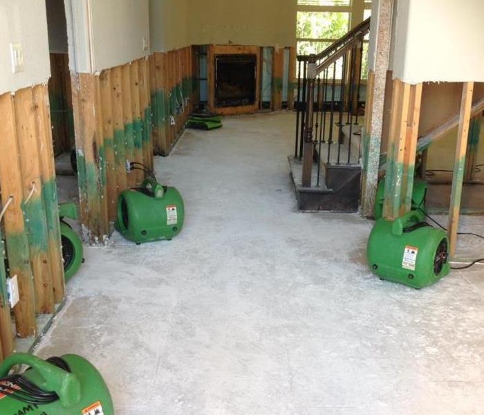 Air movers in hallway at a fire disaster.